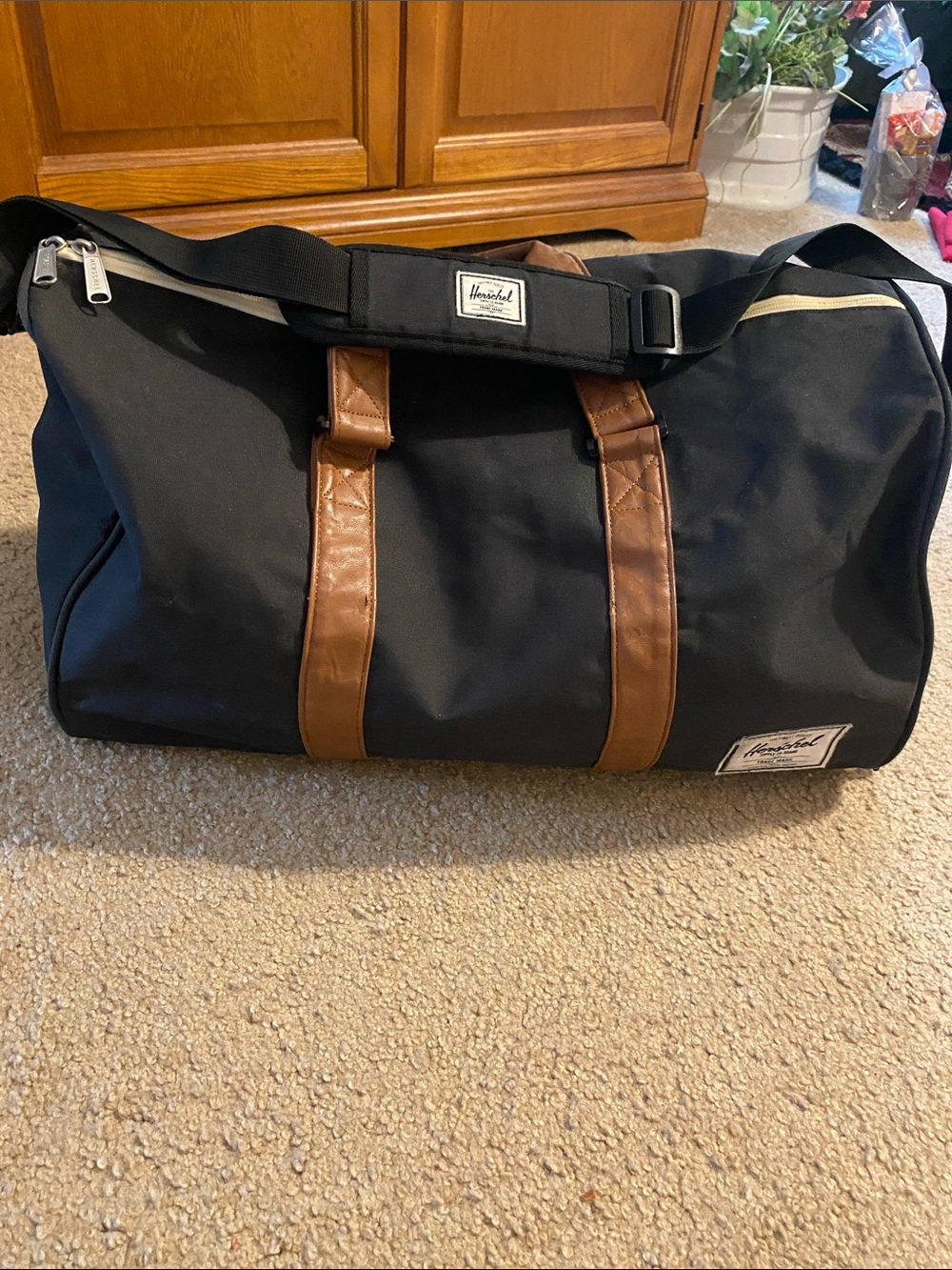 Herschel Supply Company Black Duffel with Brown Trim and Shoulder Strap